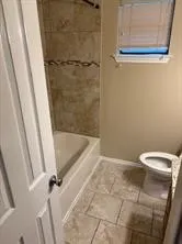 a bathroom with a glass door