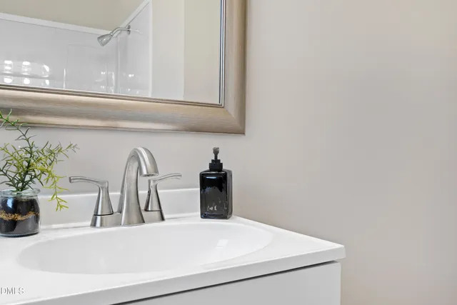 a close view of sink and cabinets