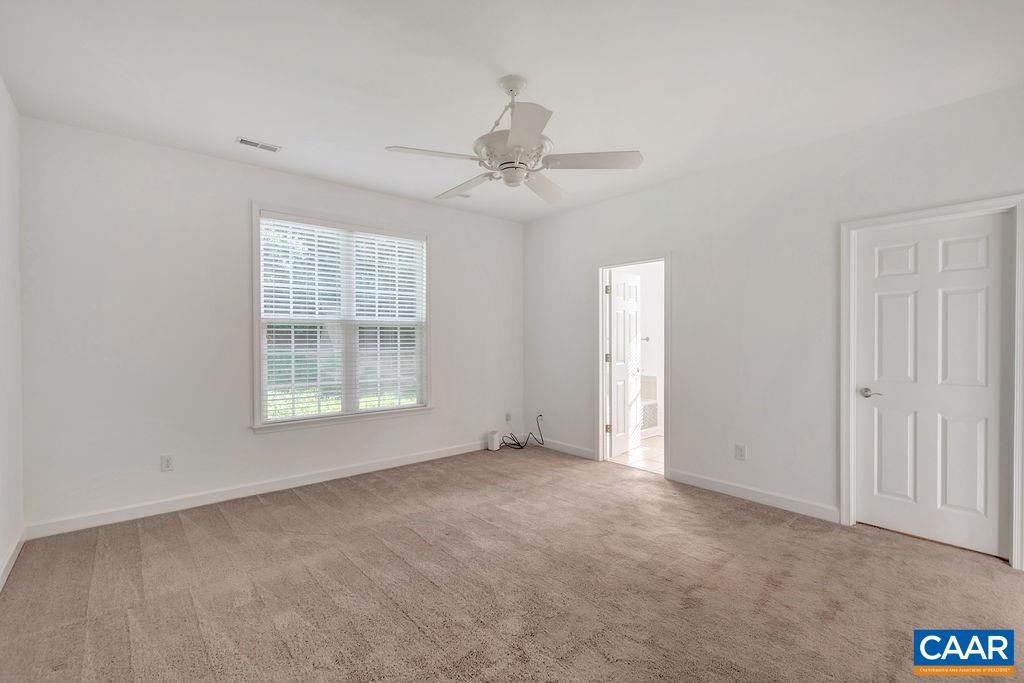 1245 Amber Ridge Road Charlottesville, VA 22901 - Photo 16 of 29 an empty room with windows and ceiling fan