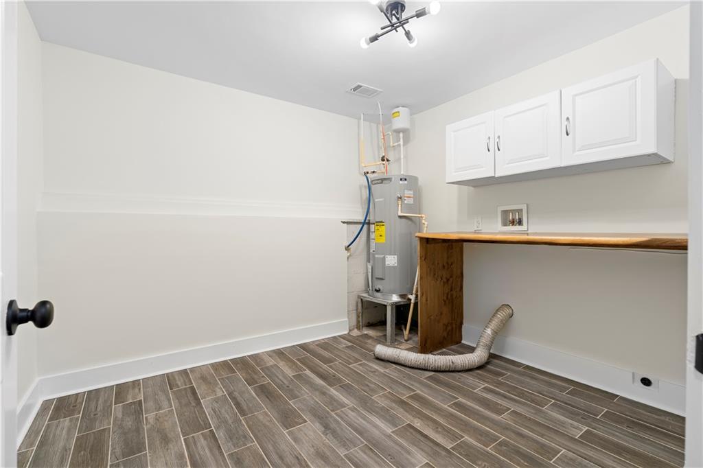 1271 Hayes Street Madison, GA 30650 - Photo 18 of 37 a view of empty room with wooden floor and fan