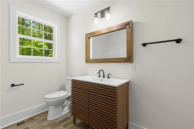 a view of a house with yard and a garden