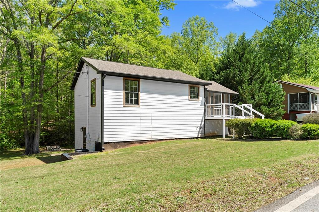 1271 Hayes Street Madison, GA 30650 - Photo 23 of 37 a view of a house with yard and a garden
