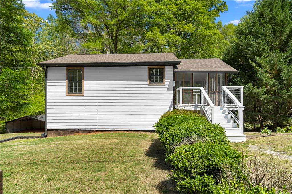 1271 Hayes Street Madison, GA 30650 - Photo 24 of 37 a front view of a house with a yard