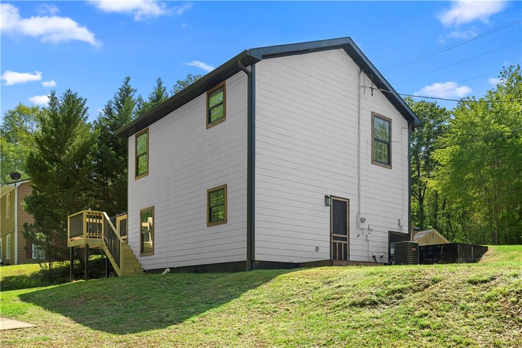 1271 Hayes Street Madison, GA 30650 - Photo 27 of 37 a view of a house with a yard