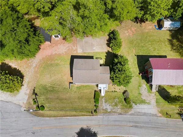 an aerial view of a house with a yard and garden