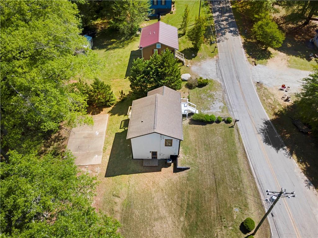 1271 Hayes Street Madison, GA 30650 - Photo 37 of 37 an aerial view of a house with a yard and garden