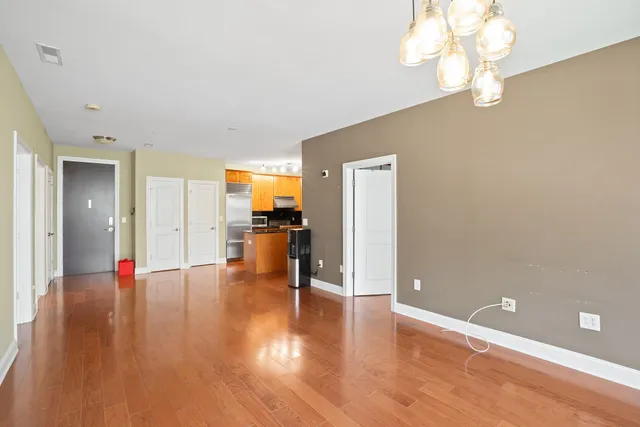 a view of a livingroom with wooden floor