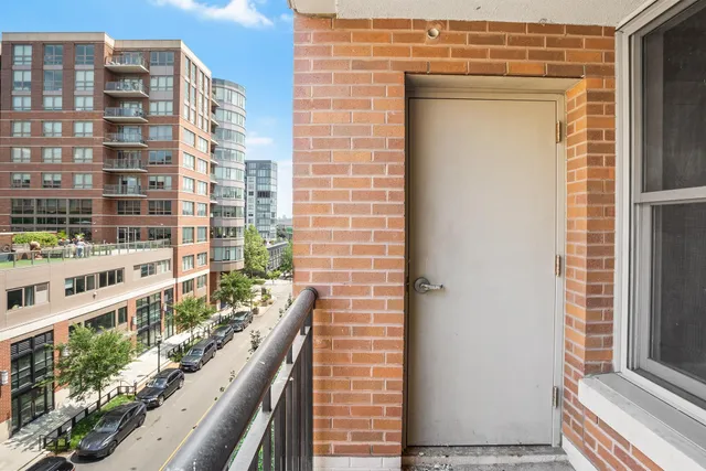 a view of balcony with wooden floor