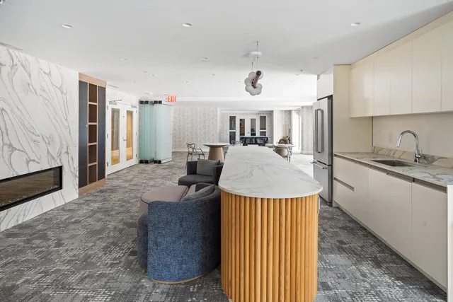 a kitchen with a stove a sink and a refrigerator