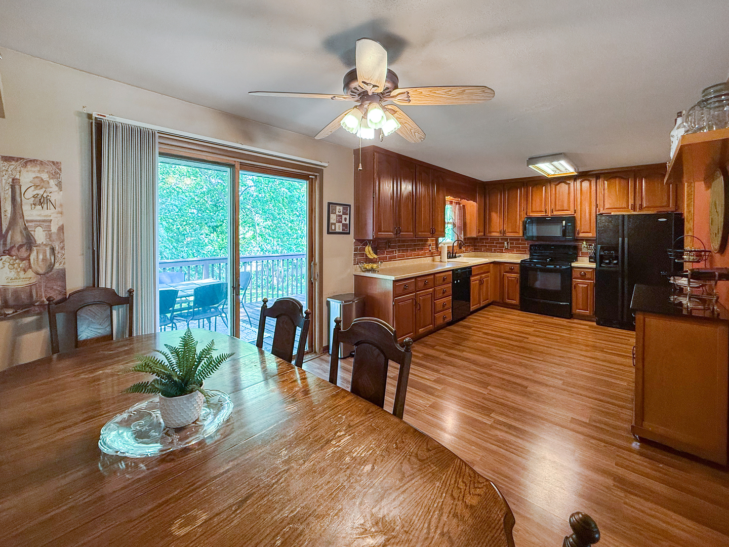 3288 Knox Drive Freeport, IL 61032 - Photo 14 of 41 a open kitchen with stainless steel appliances granite countertop wooden floor large window a sink and dining table