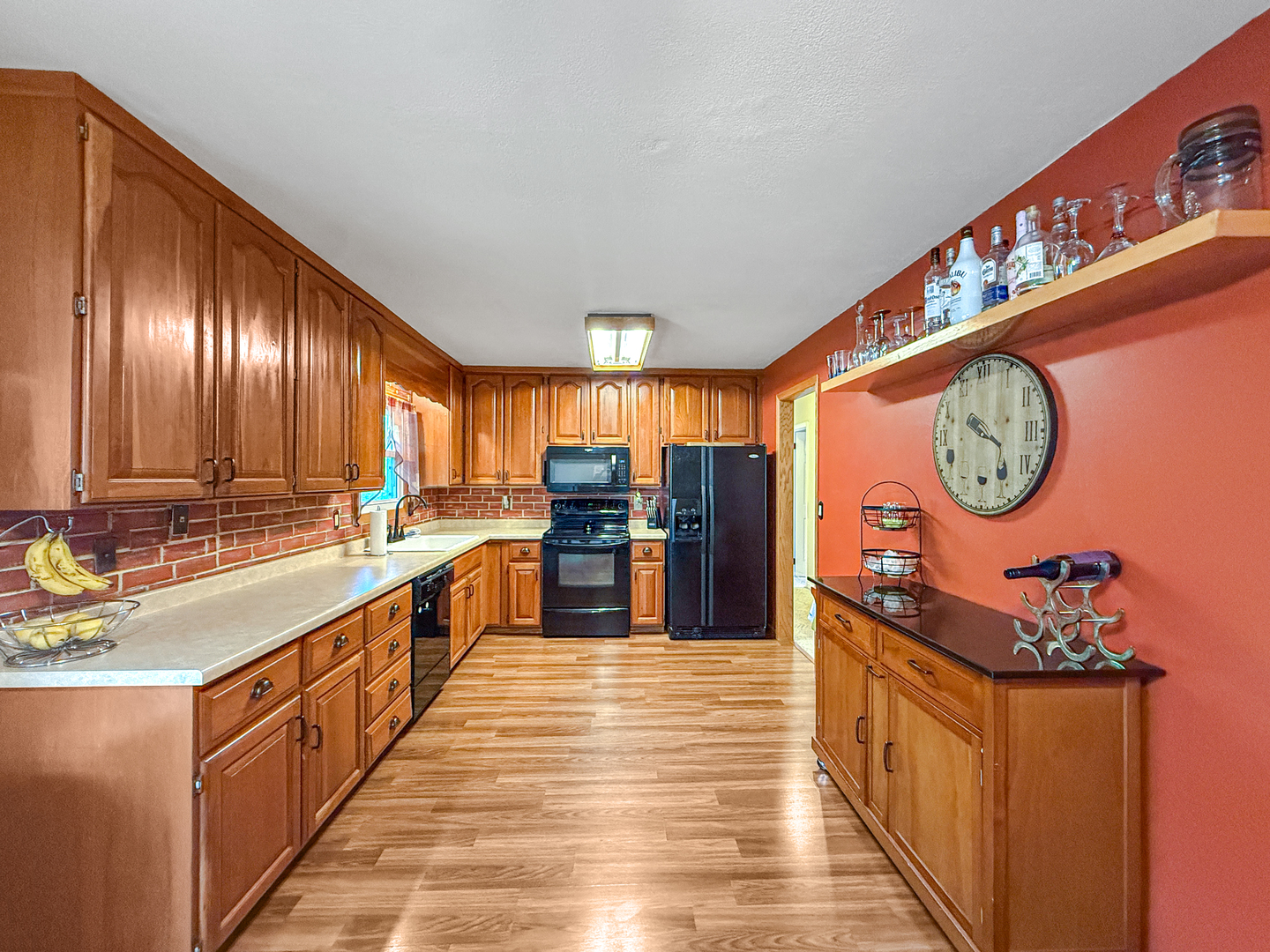 3288 Knox Drive Freeport, IL 61032 - Photo 9 of 41 a large kitchen with stainless steel appliances granite countertop a large window and a wooden floor