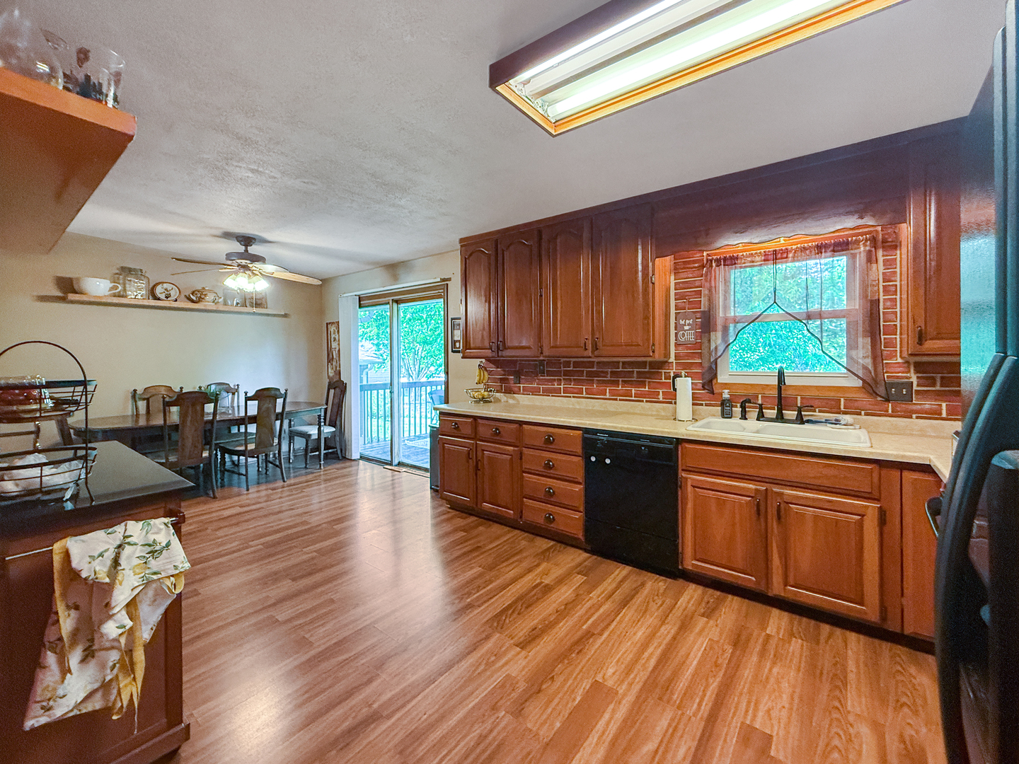3288 Knox Drive Freeport, IL 61032 - Photo 10 of 41 a kitchen with stainless steel appliances granite countertop wooden cabinets a stove a sink and a large window