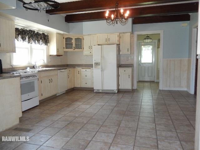 15978 West Harper Road Forreston, IL 61030 - Photo 4 of 24 a kitchen with granite countertop a stove a sink and a refrigerator