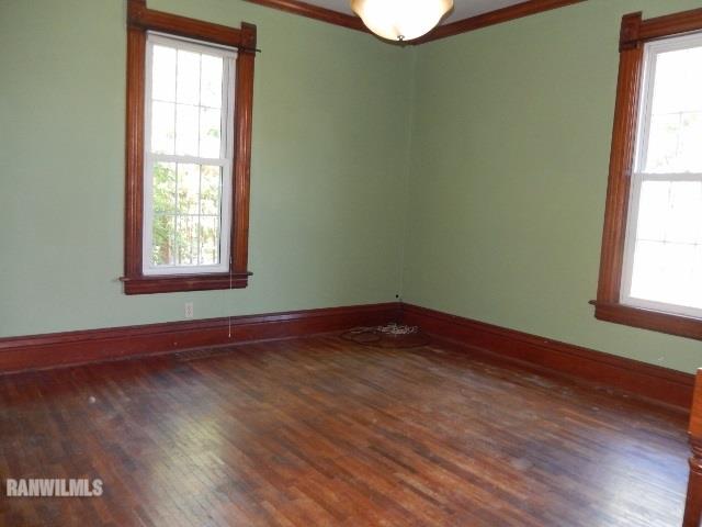 15978 West Harper Road Forreston, IL 61030 - Photo 8 of 24 a view of an empty room with wooden floor and a window