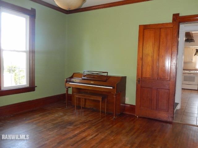 15978 West Harper Road Forreston, IL 61030 - Photo 9 of 24 a room with a piano and wooden floor