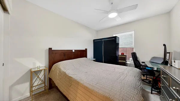 a bed room with a bed and a television