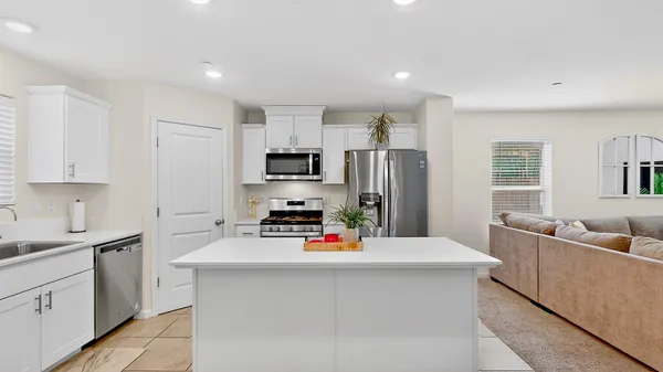 a view of a kitchen with a sink and dishwasher in kitchen