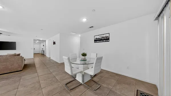 a view of kitchen with dining table and chairs