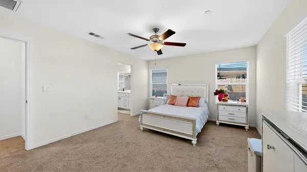 a bathroom with a sink mirror and a shower