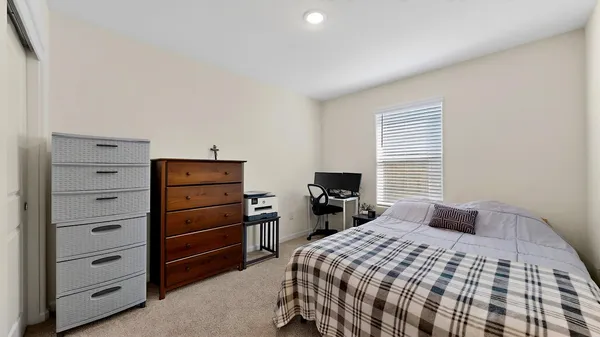 a bedroom with a bed and a television