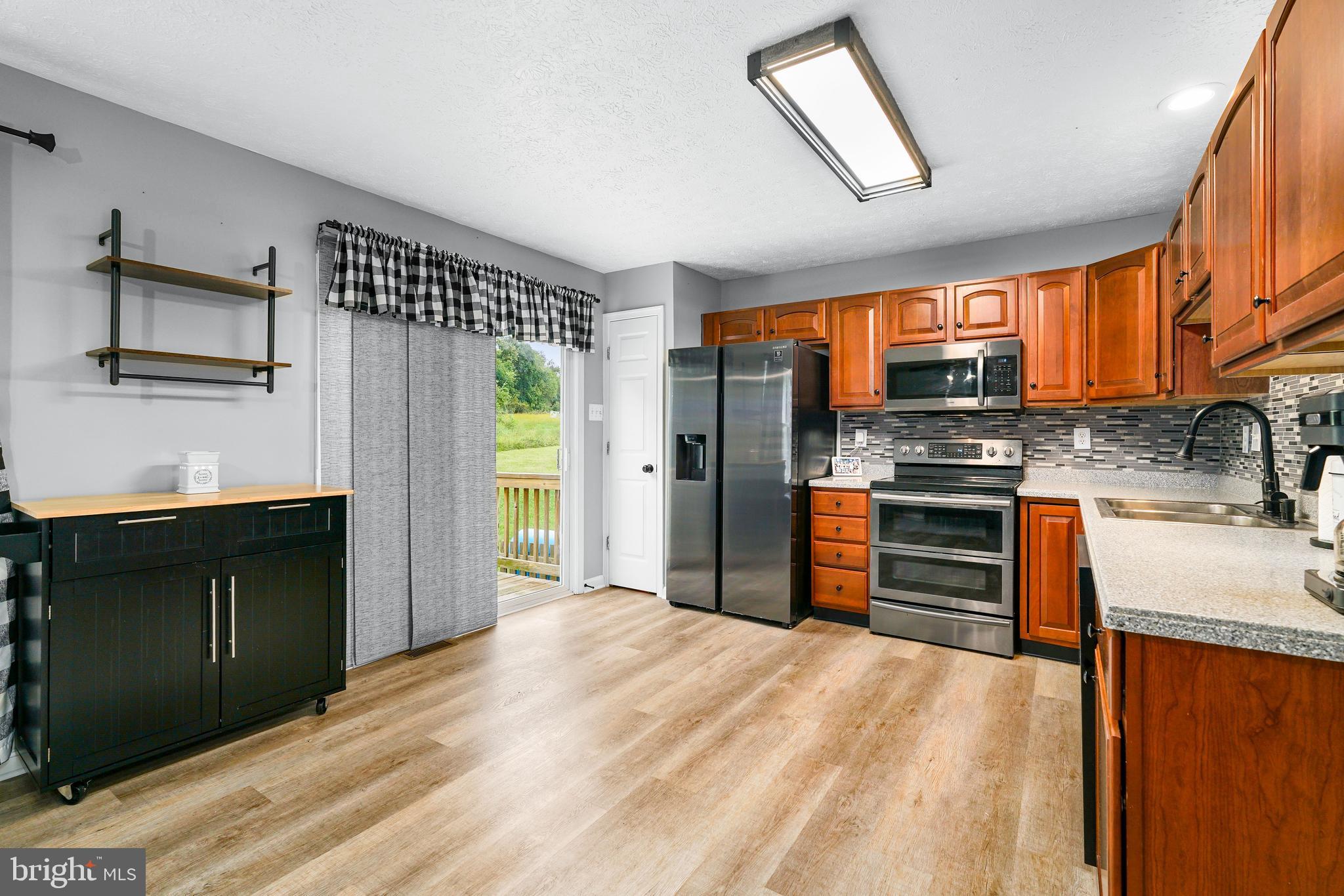 208 Maple Leaf Drive Rising Sun, MD 21911 - Photo 8 of 22 Sliders to rear deck/back yard