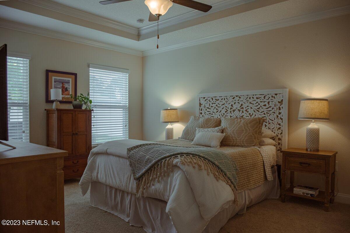 67 Salt Point St. Augustine, FL 32086 - Photo 17 of 39 a bedroom with a bed and a lamp