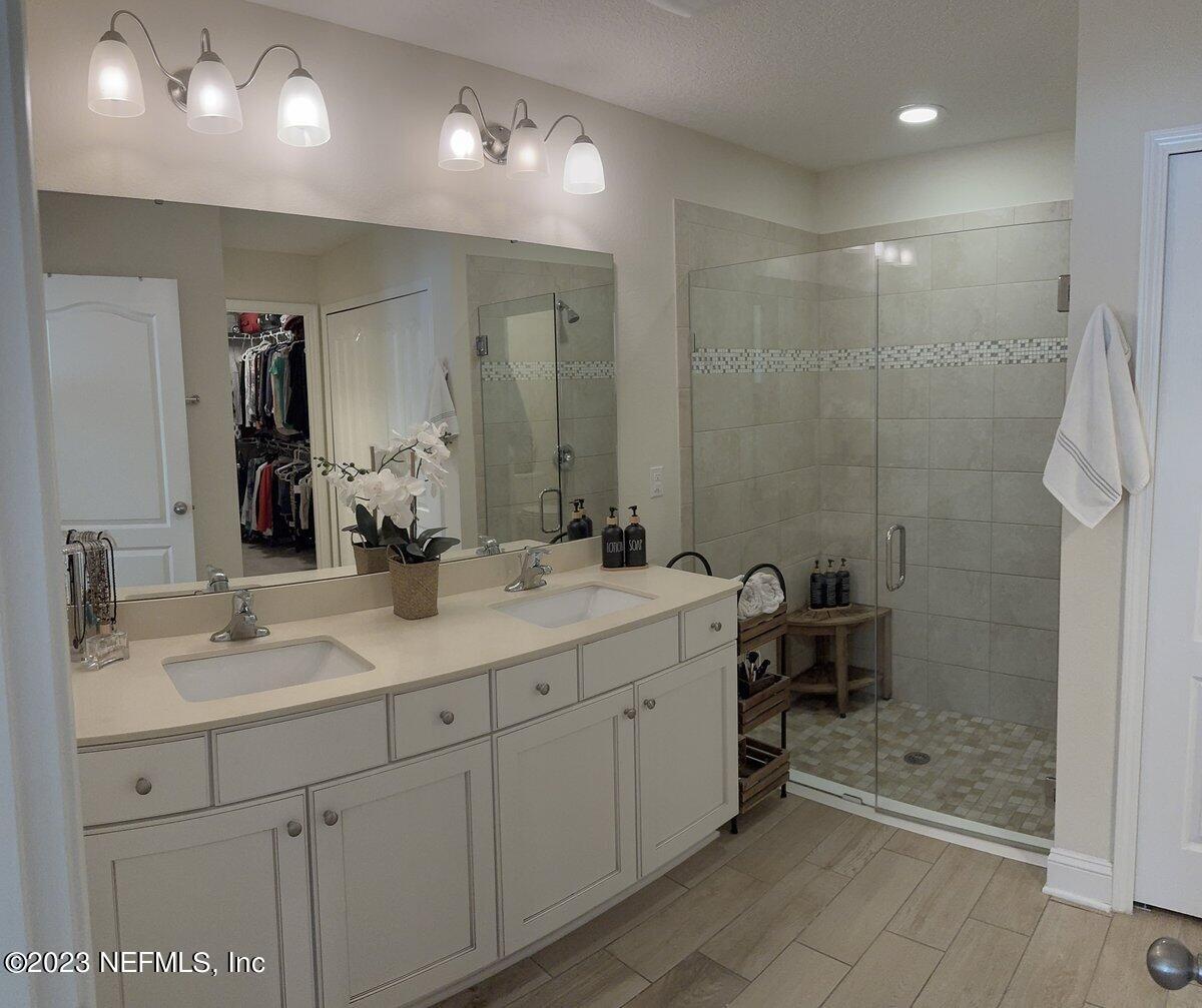 67 Salt Point St. Augustine, FL 32086 - Photo 18 of 39 a bathroom with a double vanity sink mirror and shower