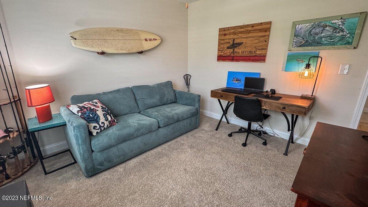 67 Salt Point St. Augustine, FL 32086 - Photo 25 of 39 a living room with furniture and a window