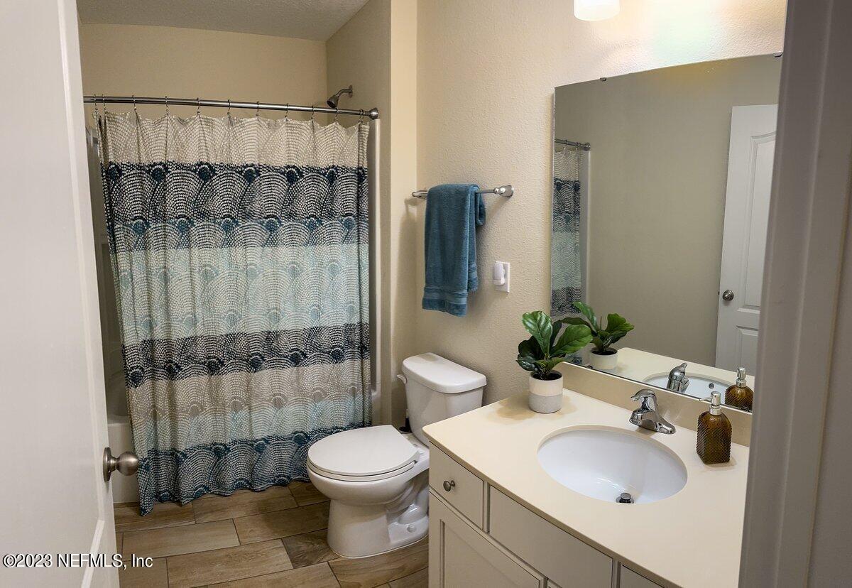 67 Salt Point St. Augustine, FL 32086 - Photo 27 of 39 a bathroom with a sink toilet and shower