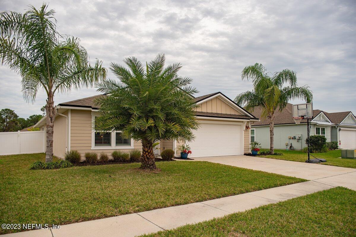 67 Salt Point St. Augustine, FL 32086 - Photo 3 of 39 a front view of house with yard and green space