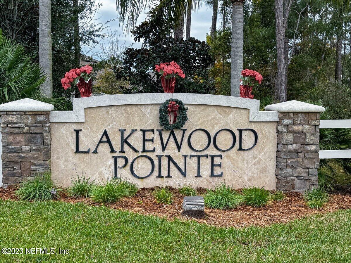 67 Salt Point St. Augustine, FL 32086 - Photo 34 of 39 a view of sign board with flower plants
