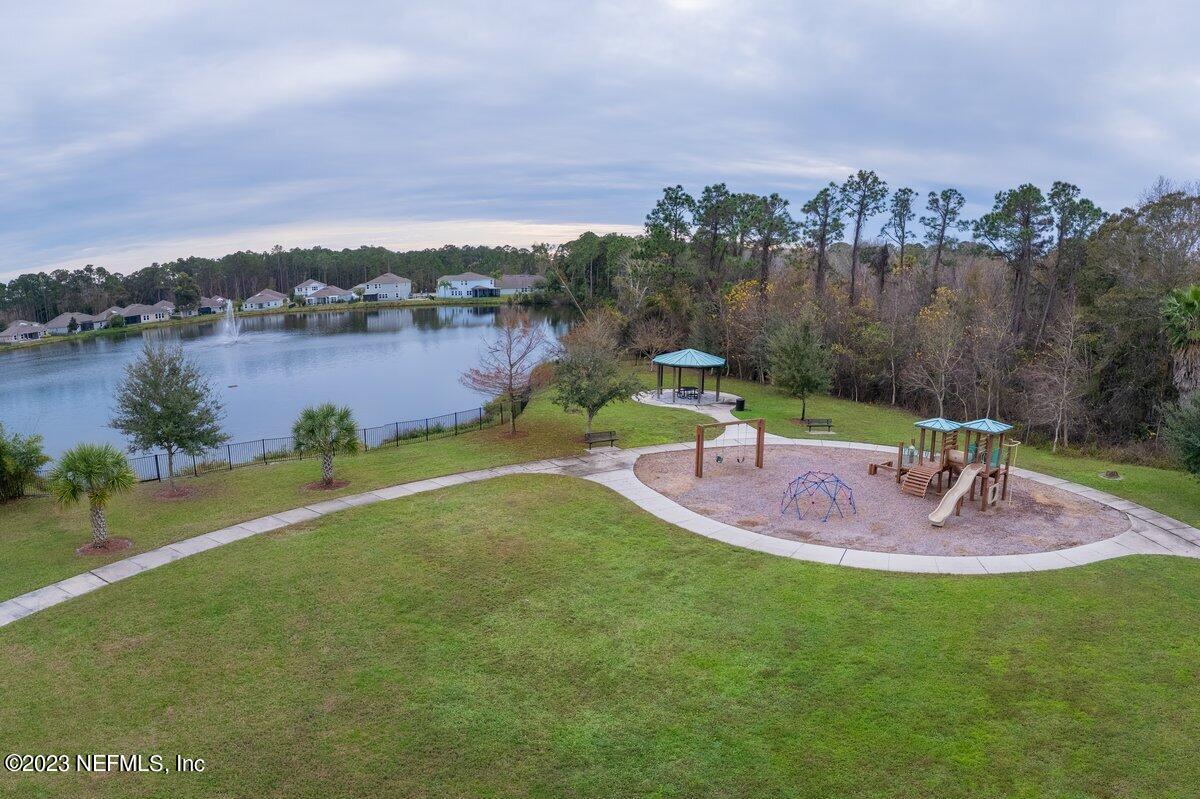 67 Salt Point St. Augustine, FL 32086 - Photo 37 of 39 a view of a lake with houses in the back
