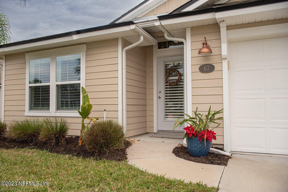 67 Salt Point St. Augustine, FL 32086 - Photo 4 of 39 a potted plant sitting in front of a house