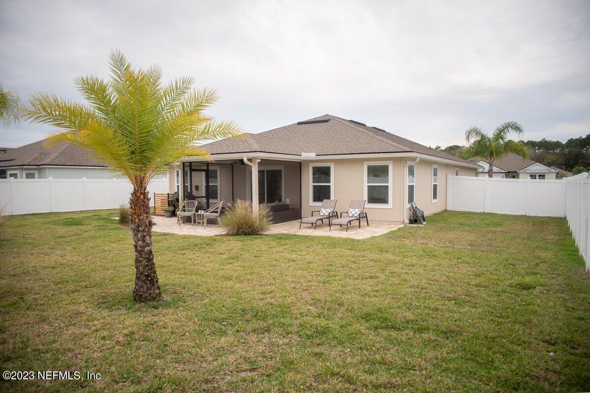 67 Salt Point St. Augustine, FL 32086 - Photo 5 of 39 a front view of a house with garden
