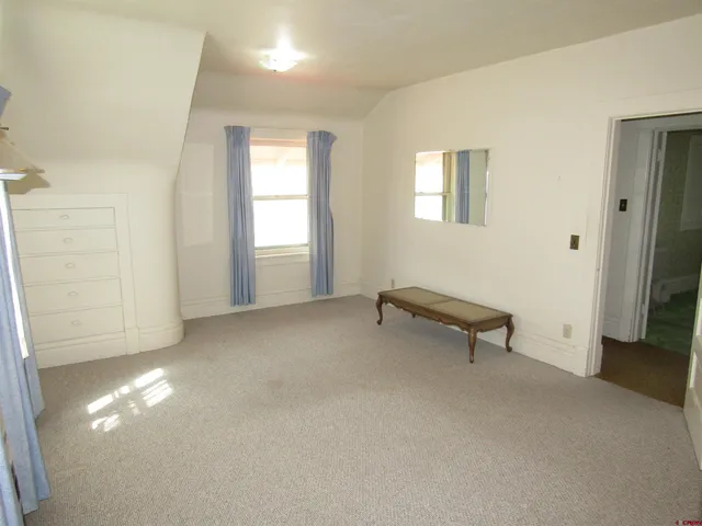 a view of empty room with windows