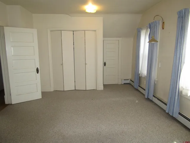 a view of a hallway with closet area