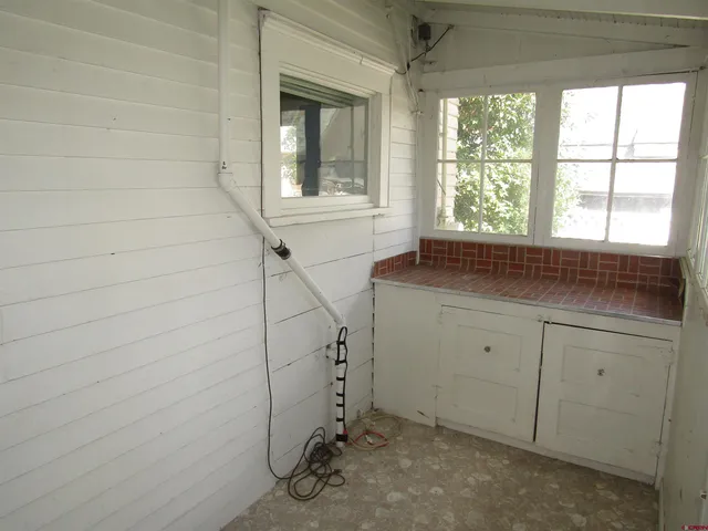a room with a sink and cabinets