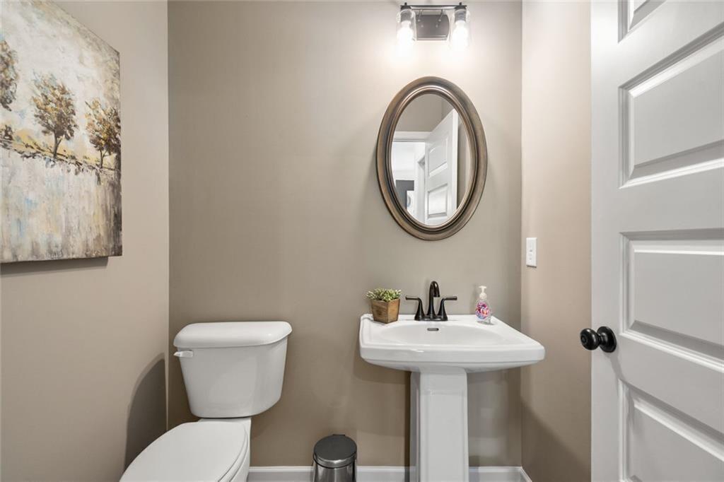 126 Sycamore Lane Calhoun, GA 30701 - Photo 15 of 31 a bathroom with a toilet sink and mirror