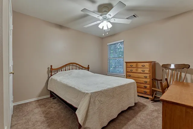 a large kitchen with a table and chairs