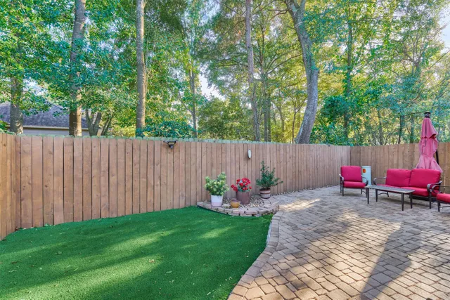 a view of a backyard with sitting area and furniture