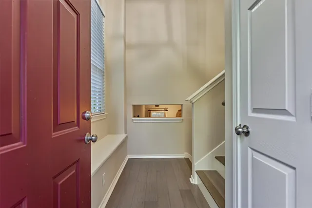 a view of a hallway with paintings on the wall