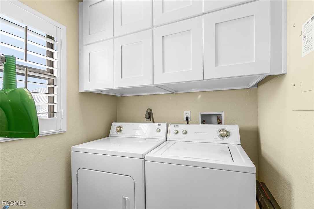 16641 Stringfellow Road, Unit 506 Bokeelia, FL 33922 - Photo 12 of 33 a utility room with dryer and washer