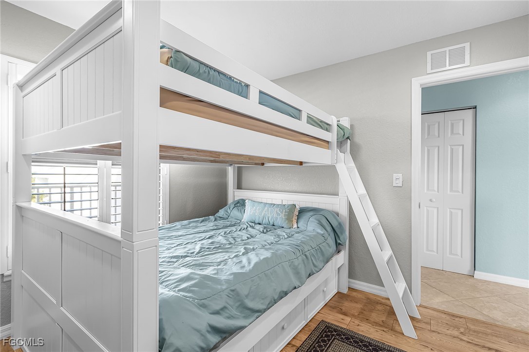 16641 Stringfellow Road, Unit 506 Bokeelia, FL 33922 - Photo 20 of 33 a bedroom with a bed and a window