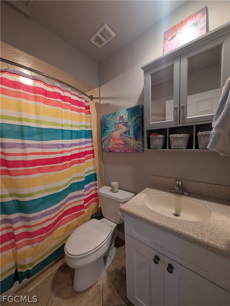 16641 Stringfellow Road, Unit 506 Bokeelia, FL 33922 - Photo 21 of 43 a bathroom with a sink toilet and shower