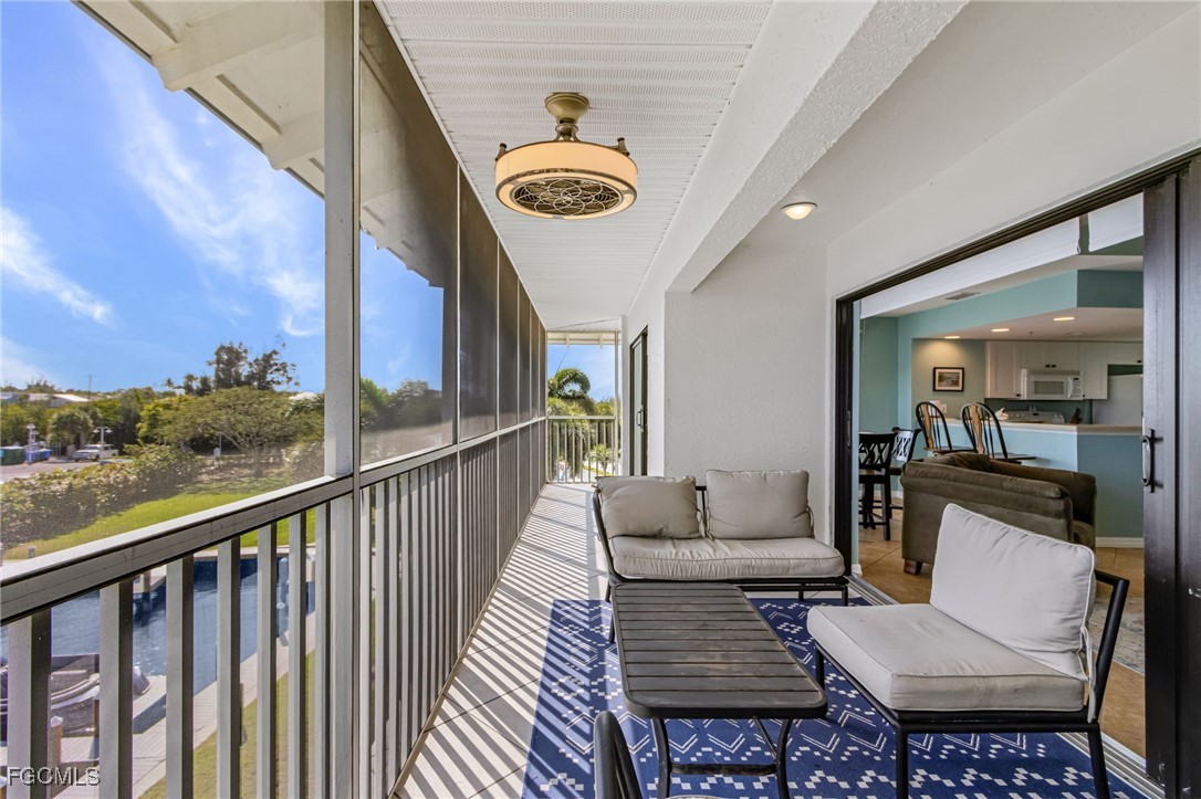 16641 Stringfellow Road, Unit 506 Bokeelia, FL 33922 - Photo 22 of 33 a view of a living room and a balcony