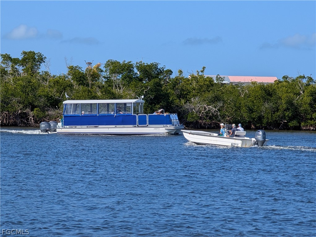 16641 Stringfellow Road, Unit 506 Bokeelia, FL 33922 - Photo 43 of 43 a view of a swimming pool with a yard