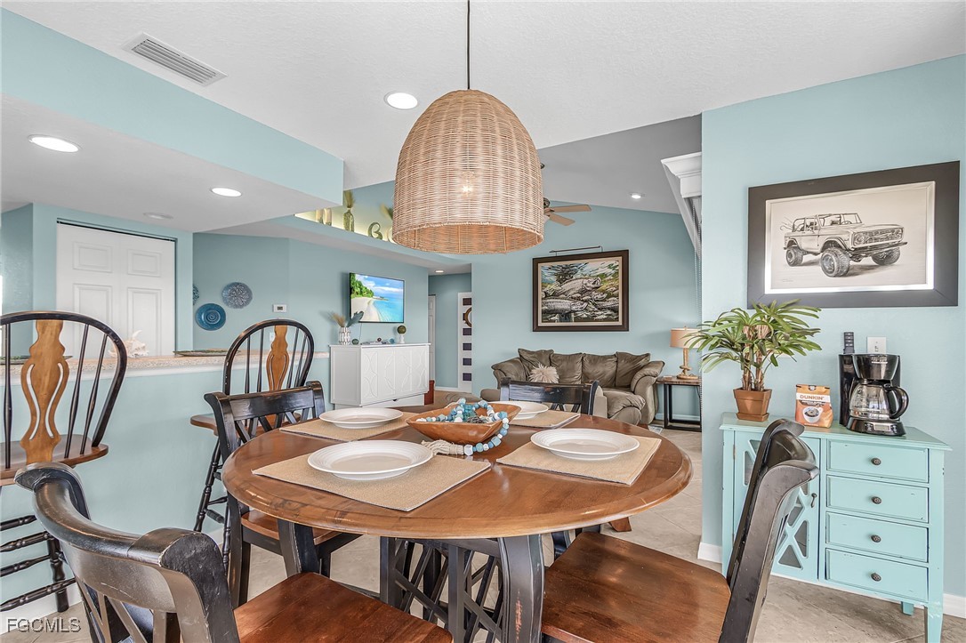 16641 Stringfellow Road, Unit 506 Bokeelia, FL 33922 - Photo 7 of 43 a view of a a dining room with furniture window and wooden floor