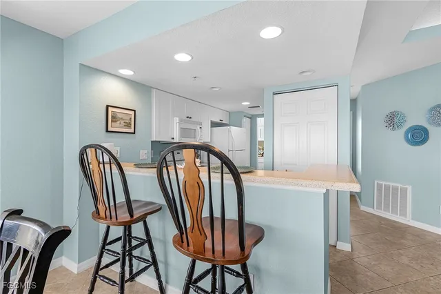a view of a hallway with furniture