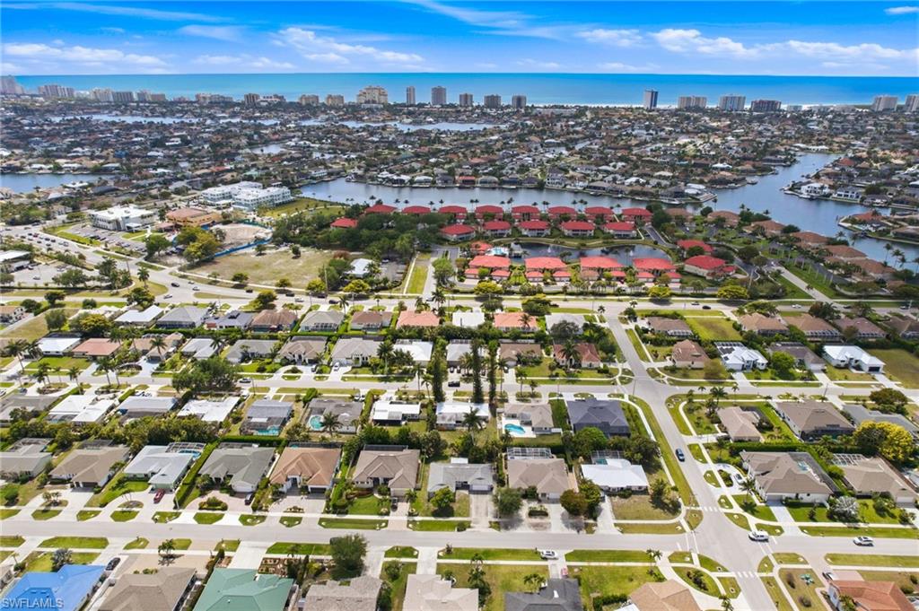178 Bermuda Road Marco Island, FL 34145 - Photo 41 of 44 Aerial view showcasing the home on Bermuda Rd with rear southern exposure and waterways and gulfront condos in the distance.