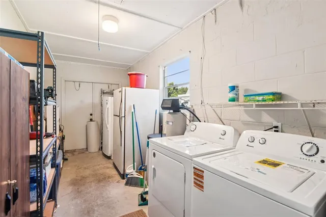 an aerial view of a house with a yard basket ball court and outdoor seating